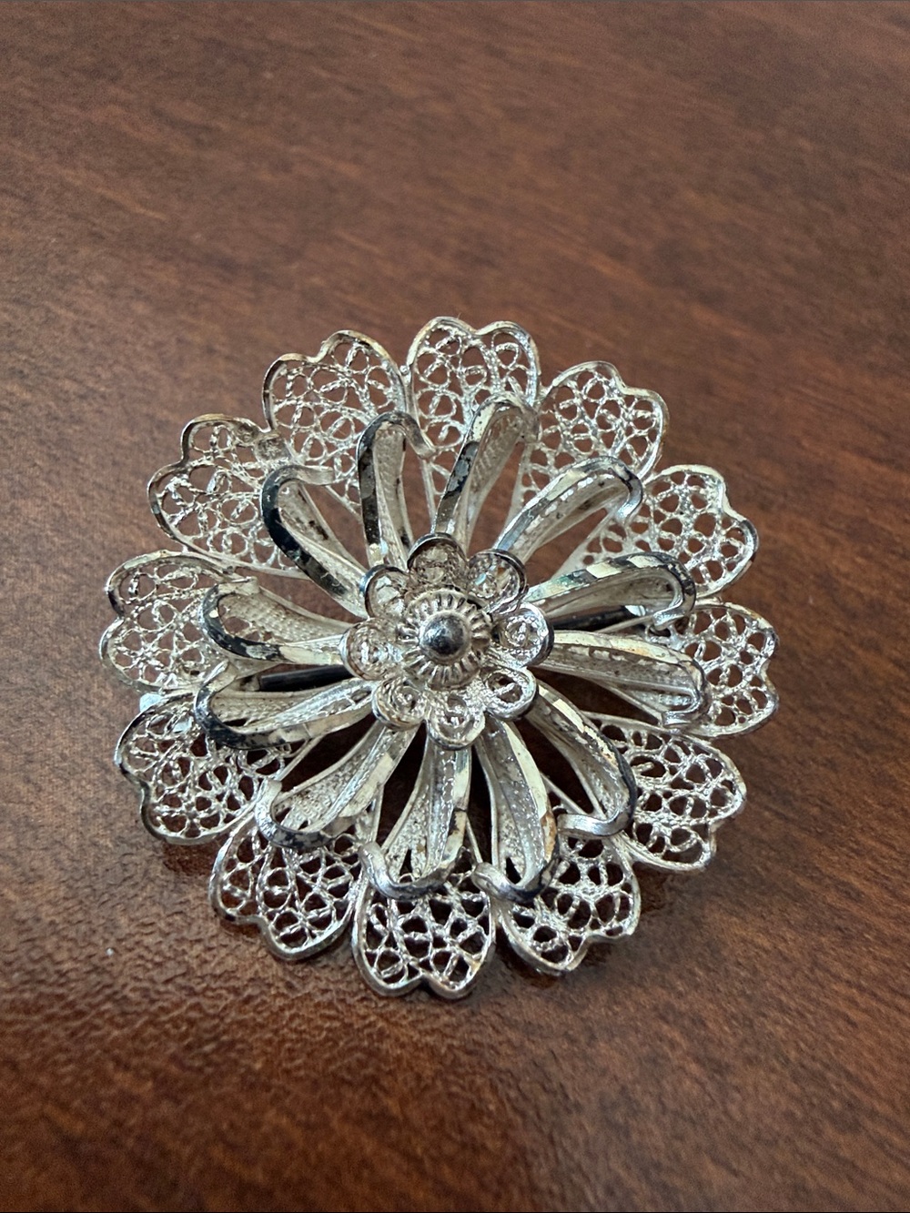 Vintage silver flower shaped filigree brooch pin